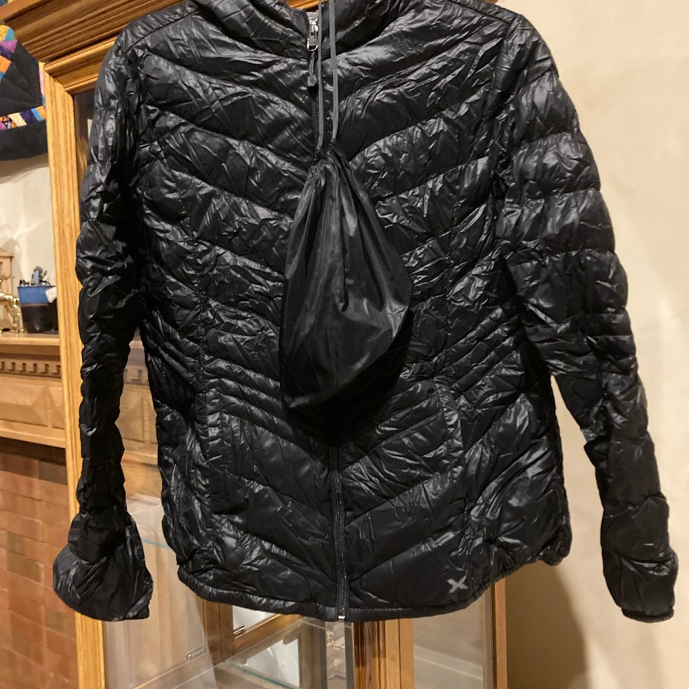 Packable down jacket.  Light and warm without weight.
